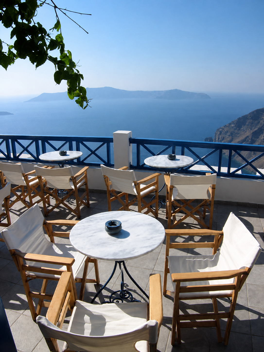 Galini Cafe terrace tables facing the Santorini caldera